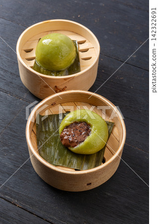 chinese Qingming festival mugwort green rice dumplings with chocolate paste filling chinese Qingming festival mugwort green rice dumplings with chocolate paste filling 142322691