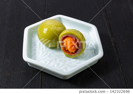 mugwort glutinous rice dumpling filled with salted egg yolk and taro mugwort glutinous rice dumpling filled with salted egg yolk and taro 142322696