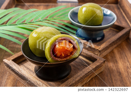 mugwort glutinous rice dumpling filled with salted egg yolk and taro mugwort glutinous rice dumpling filled with salted egg yolk and taro 142322697