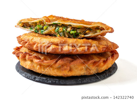 pan fried round flatbread pie stuffed with Chinese chives and egg pan fried round flatbread pie stuffed with Chinese chives and egg 142322740
