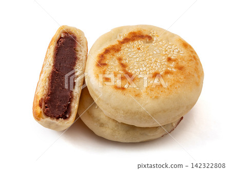 pan fried sweet red bean paste stuffed pastry topped with white sesame pan fried sweet red bean paste stuffed pastry topped with white sesame 142322808
