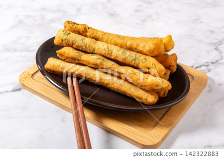 traditional Fried Dough Sticks Seasoned with Fennel Seeds 142322883