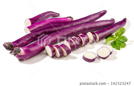 whole and Cut Asian Long Purple Eggplants Isolated on White whole and Cut Asian Long Purple Eggplants Isolated on White 142323247