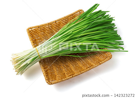 bundle of Green Garlic Chives Isolated on White Background bundle of Green Garlic Chives Isolated on White Background 142323272
