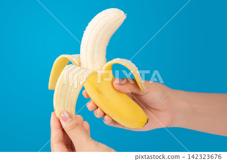 person Peeling Yellow Ripe Banana Close Up person Peeling Yellow Ripe Banana Close Up 142323676