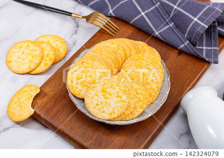 stack of Thin Crispy Potato Egg Yolk Biscuits stack of Thin Crispy Potato Egg Yolk Biscuits 142324079