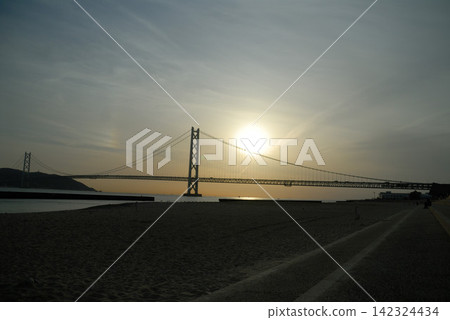The silhouette of the Seto Ohashi Bridge against the sunset The silhouette of the Seto Ohashi Bridge against the sunset 142324434
