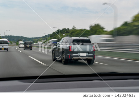 Cars driving on the Kan-Etsu Expressway and the scenery of the highway. Cars driving on the Kan-Etsu Expressway and the scenery of the highway. 142324632