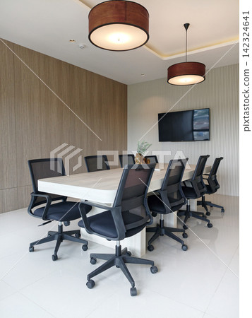 Modern boardroom table with black mesh chairs interior view Modern boardroom table with black mesh chairs interior view 142324641