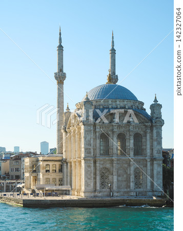 A close-up view of the twin-tower mosque located along the Bosphorus Strait in Istanbul, Turkey. A close-up view of the twin-tower mosque located along the Bosphorus Strait in Istanbul, Turkey. 142327064