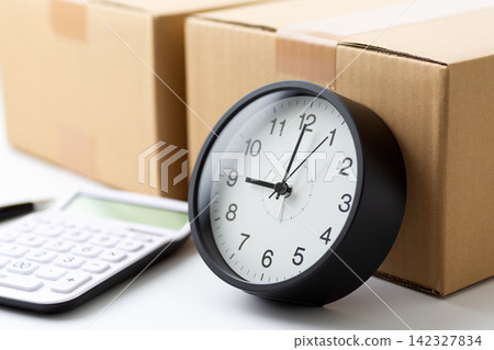 Cardboard, clock, and calculator Cardboard, clock, and calculator 142327834
