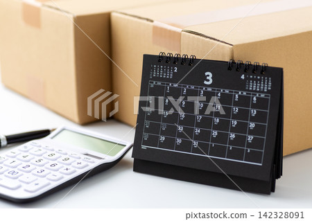 Cardboard and a March calendar 142328091