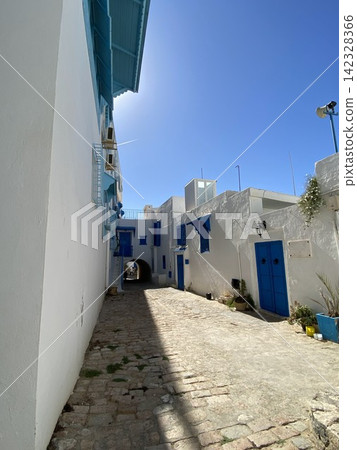 The alleyways of Sidi Bou Said, Tunisia, a UNESCO World Heritage site in 2026, are beautiful with their white walls and blue doors and windows. The alleyways of Sidi Bou Said, Tunisia, a UNESCO World Heritage site in 2026, are beautiful with their white walls and blue doors and windows. 142328366