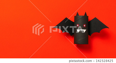 Halloween. Child-friendly bat decoration made from recycled materials Halloween. Child-friendly bat decoration made from recycled materials 142328425