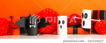 Halloween. Children create fun Halloween crafts using colorful materials Halloween. Children create fun Halloween crafts using colorful materials 142328427