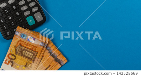 Money management and budgeting using calculator and cash for financial needs Money management and budgeting using calculator and cash for financial needs 142328669