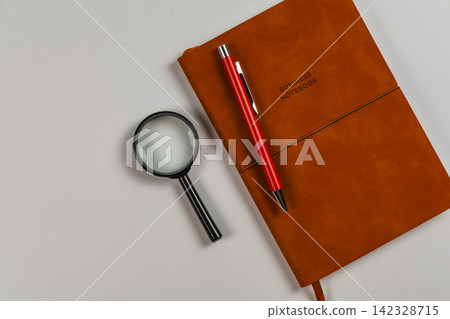 Tools for planning and analysis on a desk in an office setting Tools for planning and analysis on a desk in an office setting 142328715