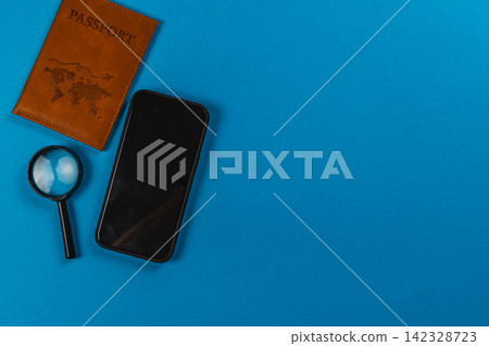 Travel items on blue background for planning and document checking Travel items on blue background for planning and document checking 142328723