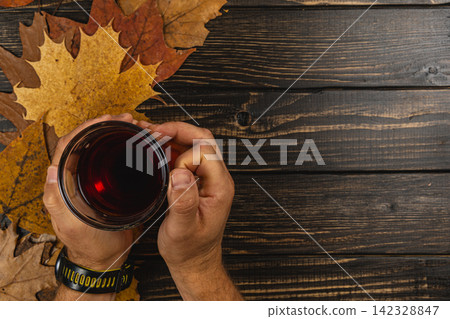 Enjoying warm tea during autumn break Enjoying warm tea during autumn break 142328847