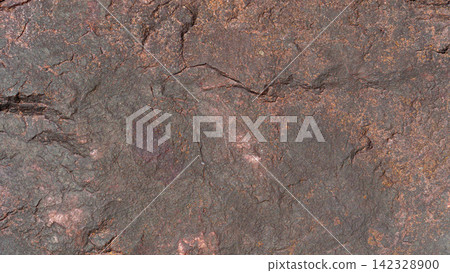 Close up above view of a rugged. Dark brown and reddish natural rock surface with rough earthy textures. Close up above view of a rugged. Dark brown and reddish natural rock surface with rough earthy textures. 142328900