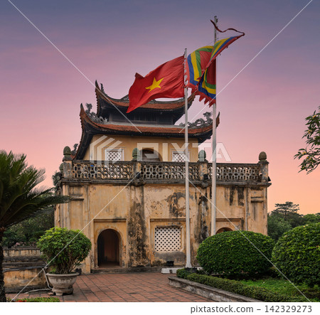 Vietnamese flag flying at Doan Mon Gate of the Imperial Citadel of Thang Long, Hanoi, Vietnam at sunset Vietnamese flag flying at Doan Mon Gate of the Imperial Citadel of Thang Long, Hanoi, Vietnam at sunset 142329273