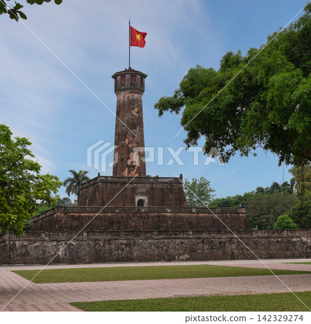 Historic Hanoi Flag Tower with the waving Vietnamese flag in Hanoi, Vietnam Historic Hanoi Flag Tower with the waving Vietnamese flag in Hanoi, Vietnam 142329274