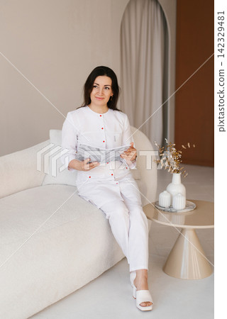 Medical Specialist Resting in Modern Office Interior Medical Specialist Resting in Modern Office Interior 142329481