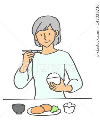 elderly woman eating elderly woman eating 142329736