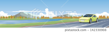 Horizontal or landscape view of yellow car driving on a scenic asphalt road. Past winter deciduous forest and river with mountains under a blue sky and white clouds.  142330908