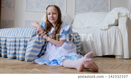 Caucasian girl in costume seated on floor smiling beside bedspread, joyful party vibe, pastel palette with ribbons and lace, playful guest role, candid family celebration atmosphere Caucasian girl in costume seated on floor smiling beside bedspread, joyful party vibe, pastel palette with ribbons and lace, playful guest role, candid family celebration atmosphere 142332337