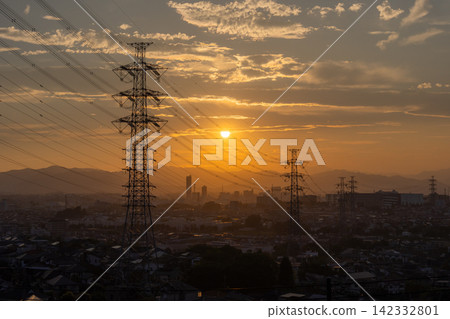 Evening view of a residential area and power transmission towers in the suburbs of Hino City, Tokyo. 142332801