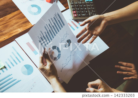 Business Meeting with graph, Growth Analysis, Charts on paper statistics data finance business Presentation to the teamwork Business Meeting with graph, Growth Analysis, Charts on paper statistics data finance business Presentation to the teamwork 142333203