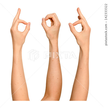 Female hand pinches thumb and finger with a tiny gap. Gesture resembles a talking mouth or holding Female hand pinches thumb and finger with a tiny gap. Gesture resembles a talking mouth or holding 142333322