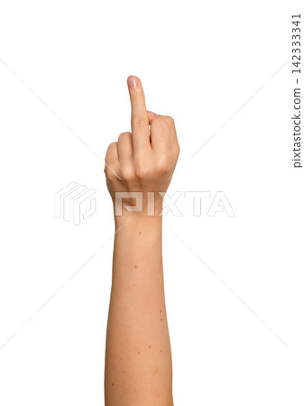 Female hand shows middle finger directly toward camera. Gesture appears bold and confrontational in Female hand shows middle finger directly toward camera. Gesture appears bold and confrontational in 142333341