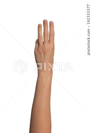 Female left hand raises three fingers upward in a row. Gesture suggests counting or showing the Female left hand raises three fingers upward in a row. Gesture suggests counting or showing the 142333377