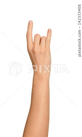 Female right hand forms a rock horn gesture. Index and pinky extend while other fingers fold in. Female right hand forms a rock horn gesture. Index and pinky extend while other fingers fold in. 142333408