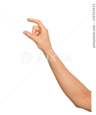 Female right hand pinches thumb and index finger apart. Digits hold something small and invisible Female right hand pinches thumb and index finger apart. Digits hold something small and invisible 142333413