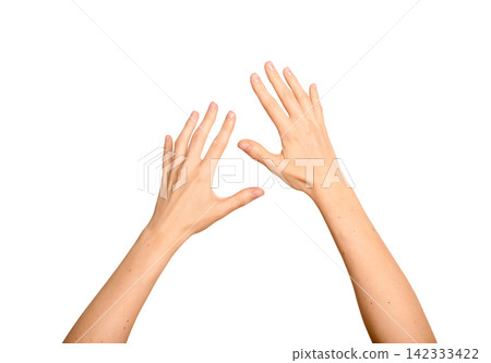Two female hands interact with an unseen digital object. Fingers reach and touch something invisible Two female hands interact with an unseen digital object. Fingers reach and touch something invisible 142333422