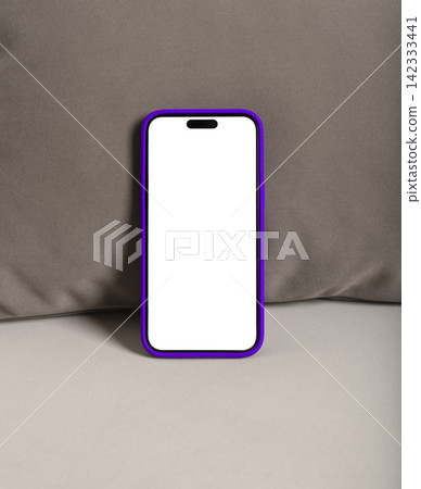 Smartphone with blank screen on a velvet sofa. Purple phone case and minimal mockup setup. Ideal for app advertising and product presentation.. 142333441
