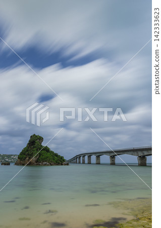 Japan - Okinawa Prefecture, Kouri Bridge and Kouri Island, with a view of the blue sea, Frog Island, and coastal scenery. Japan - Okinawa Prefecture, Kouri Bridge and Kouri Island, with a view of the blue sea, Frog Island, and coastal scenery. 142333623