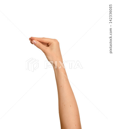 Hand raised with thumb and finger touching playfully. Woman s arm lifted in an expressive talking Hand raised with thumb and finger touching playfully. Woman s arm lifted in an expressive talking 142336085