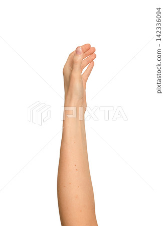 Left hand raised as if grasping something unseen. Woman s arm reaching upward in a grabbing motion. Left hand raised as if grasping something unseen. Woman s arm reaching upward in a grabbing motion. 142336094