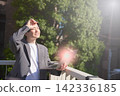 Office workers open their laptops and work in the strong sunlight. 142336185