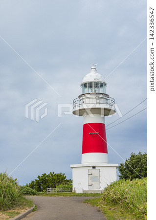 Japan, Shakotan Town, Shakotan Cape: The vibrant red and white Shakotan Cape Lighthouse stands tall at Shakotan Cape. Japan, Shakotan Town, Shakotan Cape: The vibrant red and white Shakotan Cape Lighthouse stands tall at Shakotan Cape. 142336547