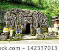 The entrance to the ancient Goa Gajah ruins in Ubud, Bali, and its impressive giant reliefs. 142337013