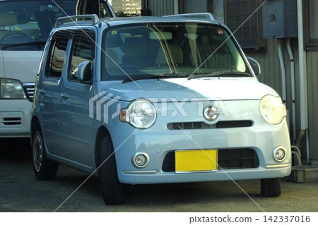 Car parked in parking lot Car parked in parking lot 142337016