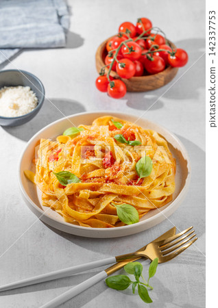Homemade Tagliatelle Pasta with Tomato Sauce, Basil and Parmesan Homemade Tagliatelle Pasta with Tomato Sauce, Basil and Parmesan 142337753