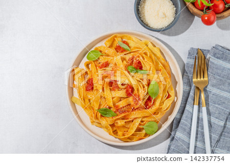 Homemade Tagliatelle Pasta with Tomato Sauce, Basil and Parmesan Homemade Tagliatelle Pasta with Tomato Sauce, Basil and Parmesan 142337754