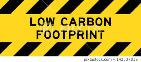 Yellow and black color with line striped label banner with word low carbon footprint 142337819