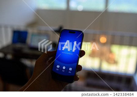 The word "AI" appears on the smartphone screen. The word "AI" appears on the smartphone screen. 142338484